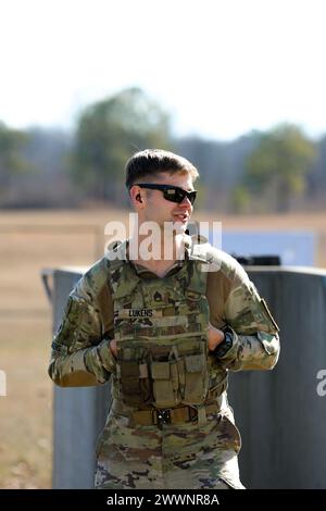 Tennessee Army National Guardsman Staff Sgt. William Lukens, from the 278th Armored Cavalry Regiment, speaks to a range safety at the Tennessee State Best Warrior Competition in Tullahoma, Feb. 23, 2024. All competitors zeroed their M-4 weapons prior to continuing with a series of battle stations.  Army National Guard Stock Photo