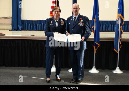 Col. Lynn Lee, 111th Attack Wing Commander, passes the unit colors to ...