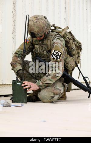 Tennessee Army National Guardsman Staff Sgt. Christopher Thomas, from the 117th Regional Training Institute, assembles a radio at the Tennessee State Best Warrior Competition, in Tullahoma, Feb. 24, 2024. This was a part of the final event of the valor run.  Army National Guard Stock Photo