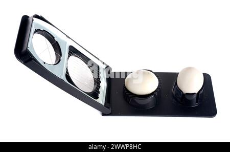 Egg slicer in front of white background Stock Photo