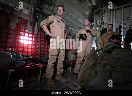 Amman, Jordan. 25th Mar, 2024. Bundeswehr pilots at the briefing before take-off towards Gaza on board a C-130 Hercules transport aircraft of the German Air Force. The Bundeswehr is participating with other nations in aid flights in which relief supplies are dropped from transport aircraft. Credit: Boris Roessler/dpa/Alamy Live News Stock Photo