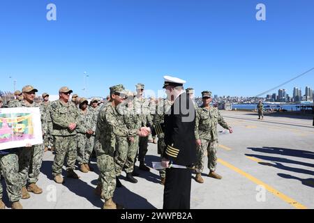 Rear Adm. Guido Valdes, director of the Defense Health Network Pacific Rim (DHNPR) and Commander, Naval Medical Forces Pacific, welcomes Capt. David Burke, USNS Mercy (T-AH 19) executive officer, home from deployment. Mercy returned to its homeport in San Diego after a four-month deployment in support of Pacific Partnership 2024. Pacific Partnership is the largest annual multinational humanitarian assistance and disaster relief preparedness mission conducted in the Indo-Pacific area of operations. Engagements between USNS Mercy’s crew and host nations ensure the international community is bett Stock Photo