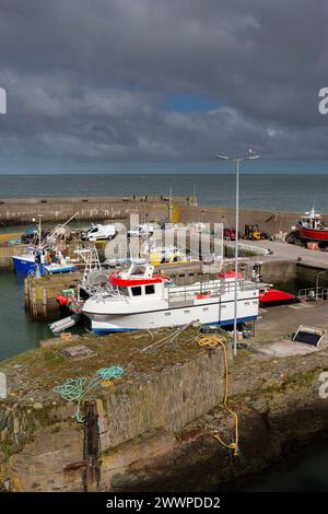 Amlwch Harbour with fishing boats vessels moored. Amlwch Port, Anglesey, Wales, United Kingdom. 23rd March 2024 Stock Photo