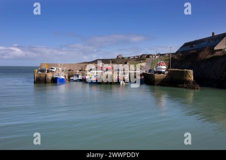 Amlwch Harbour with fishing boats vessels moored. Amlwch Port, Anglesey, Wales, United Kingdom. 23rd March 2024 Stock Photo