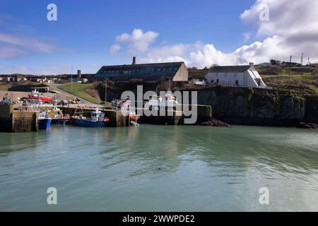 Amlwch Harbour with fishing boats vessels moored. Amlwch Port, Anglesey, Wales, United Kingdom. 23rd March 2024 Stock Photo