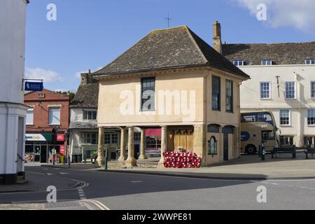 Old town hall building with a bus parked behind at the bus stop in Faringdon, Oxfordshire, England, UK Stock Photo