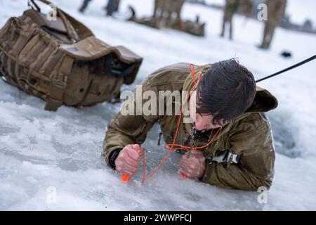 Special Warfare Tactical Air Control Party Airmen with the 124th Fighter Wing’s Air Support Operations Squadron participate in cold weather survival training at Cascade Lake in Donnelly, Idaho, February 7, 2024. Through cold water submersion, The 124th ASOS members are able to push themselves to the limits and learn valuable skills.  Air National Guard Stock Photo