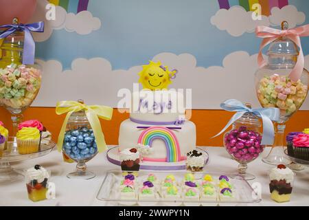 A variety of desserts and candies displayed on a table Stock Photo