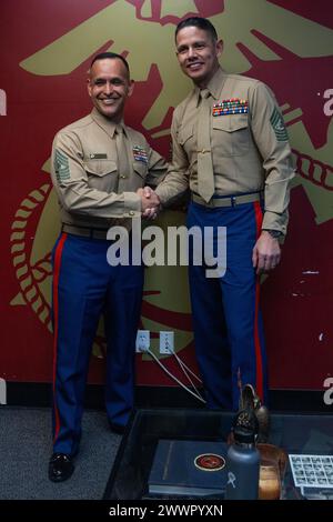 U.S. Marine Corps Sgt. Maj. Carlos Ruiz, the 20th Sergeant Major of the Marine Corps, right, poses for a photograph with Master Gunnery Sgt. Osvaldo Hernandez, the recruiter instructor for Recruiting Station Orange County, left, at Recruiting Substation Santa Ana in Santa Ana, Calif., Feb. 5, 2024. During his visit, Ruiz spoke with local recruiters and poolees to gain insight into recruiting operations in the local area.  Marine Corps Stock Photo