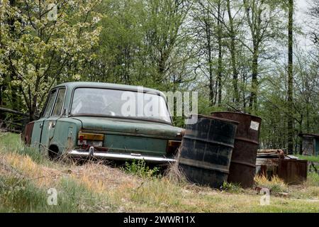 HRADEK, CZECH REPUBLIC - MAY 1, 2016: Old Fiat 125p wreck car left in a forest in Beskydy Mountains, Czech Republic Stock Photo