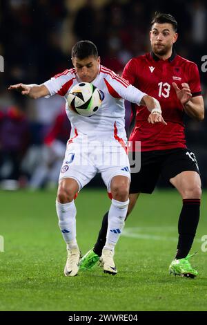 Parma, Italy. 22 March 2024. Alexis Sanchez of Chile competes for the ball with Enea Mihaj of Albania during the international friendly football match between Albania and Chile. Credit: Nicolò Campo/Alamy Live News Stock Photo