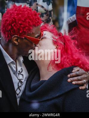 A mixed race couple with red hair kissing. Stock Photo