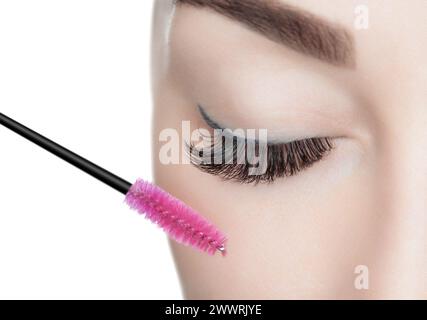 Beautiful Woman with long eyelashes in a beauty salon. Eyelash extension procedure. Lashes close up Stock Photo