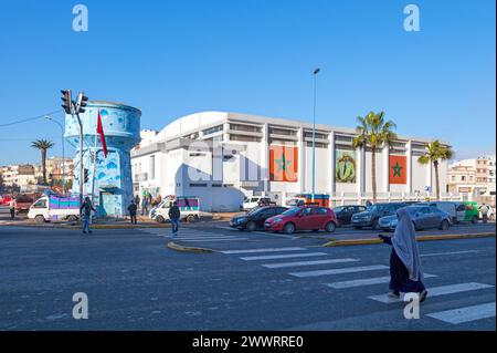 Casablanca, Morocco - January 17 2019: People crossing the crosswalk in front of the water tower and Zerktouni covered hall. Stock Photo