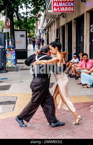 Two Senior Tango Dancers Dancing In The Street, San Telmo District, Buenos Aires, Argentina. Stock Photo