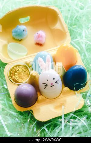 Pastel Egg Carton of Hand Decorated Easter Eggs and Bunnies, USA, 2024 Stock Photo