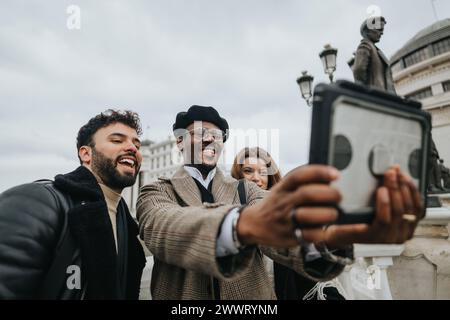 Happy young business entrepreneurs taking selfie in urban cityscape. Stock Photo