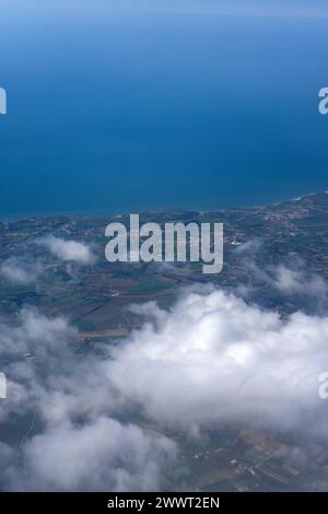 Breathtaking aerial view of Portugal's stunning coastline, captured from a window seat of an airplane. Serene beauty from above. Stock Photo