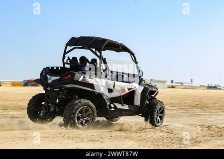 Off road buggy car in the sand dunes of the Qatar desert Stock Photo