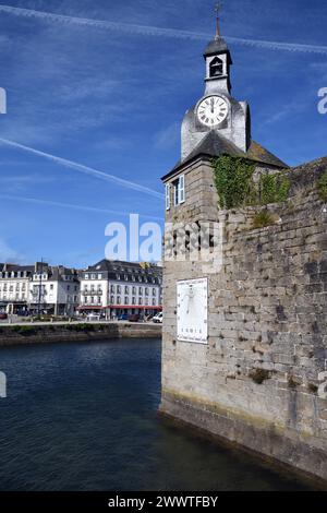 southwest corner of the wall of Ville Close with clock and sundial, restaurant L'Amiral in the background, France, Brittany, Concarneau Stock Photo