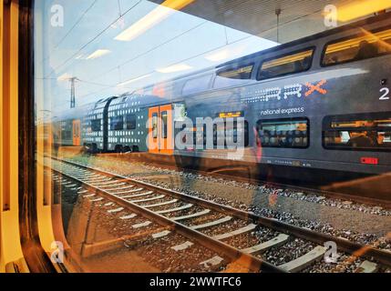 view from a train onto a double-decker regional train of National Express, Germany, North Rhine-Westphalia, Lower Rhine, Dusseldorf Stock Photo