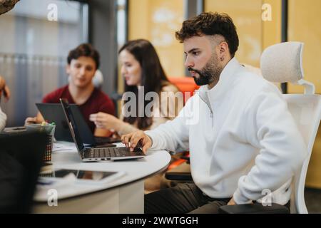 Young group of professionals collaborating on business strategy. Stock Photo
