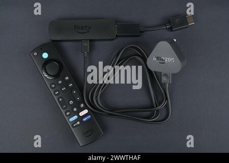 Amazon Fire TV Stick 4K MAX 2023 with connected HDMI cable and USB power plug and the remote. Stafford, United Kingdom. March 24, 2024. Stock Photo