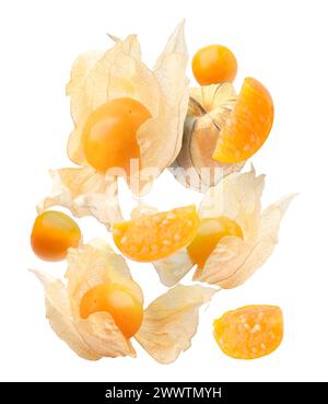 Ripe orange physalis fruits with calyx falling on white background Stock Photo
