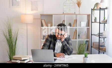 Business analysis video office man laptop papers Stock Photo