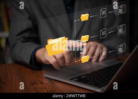IT working on computer Business processes Document Management System DMS business processes and ensuring digital security. store, share, and organize Stock Photo