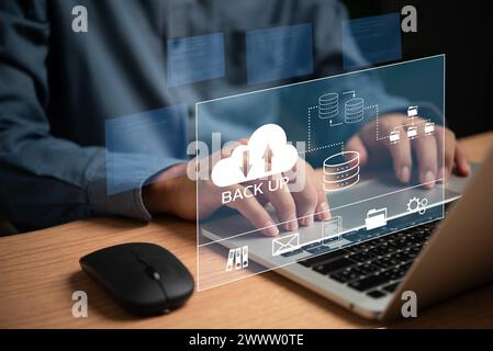 Businessman Interacting with a Backup Interface virtual cloud network data security system internet online with futuristic holographic digital technol Stock Photo