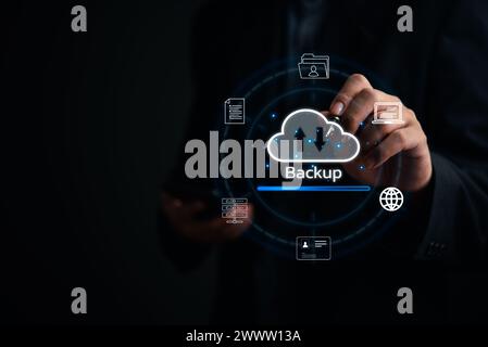 Businessman Interacting with a Backup Interface virtual cloud network data security system internet online with futuristic holographic digital technol Stock Photo