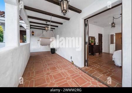 Living room with hammock and wooden flooring Stock Photo