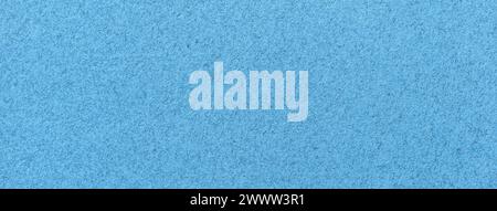 Texture of old light blue paper closeup. Structure of a matte dense sky cardboard wallpaper. Denim felt background. Stock Photo