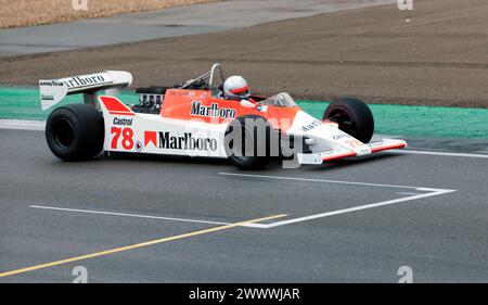 Warren Briggs driving his Red and White, 1980, McLaren M29, during the  Masters Racing Legends Formula One Race ('66-'85). Stock Photo