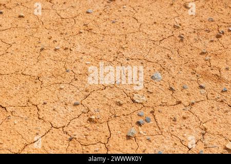Drought land or cracked land with little stones or pebbles in full frame view background photo. Stock Photo