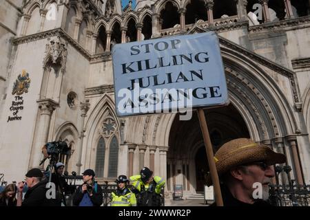 March 26, 2024, London, England, United Kingdom: In the heart of London, a significant gathering is underway at the Royal Courts of Justice on Strand, where supporters of Julian Assange convene for the â€œProtest to Defend a Free Press Decision Day.â€ This event marks the final appeal decision concerning Assangeâ€™s extradition case. The atmosphere is charged with anticipation as attendees, from various walks of life, unite in their call for press freedom and transparency. (Credit Image: © Joao Daniel Pereira/ZUMA Press Wire) EDITORIAL USAGE ONLY! Not for Commercial USAGE! Stock Photo