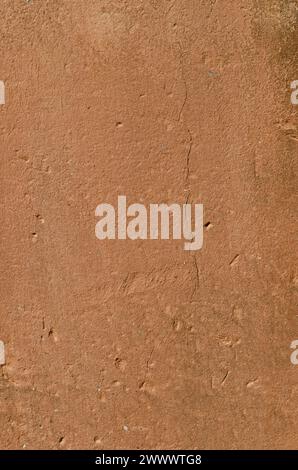 texture, old wall with clay plaster, full of holes, cracks and mold Stock Photo