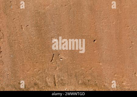 texture, old wall with clay plaster, full of holes, cracks and mold Stock Photo