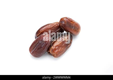 Image of tasty dried dates fruits isolated on white background. Clipping path. Vegetarian and healthy snack. Stock Photo