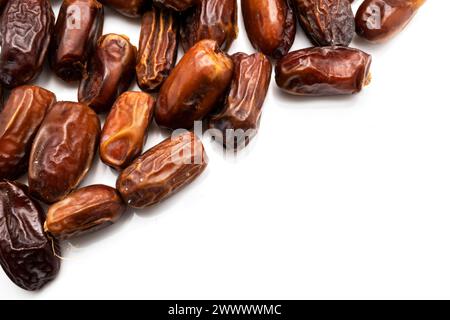 Image of tasty dried dates fruits isolated on white background. Clipping path. Vegetarian and healthy snack. Stock Photo