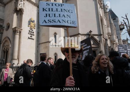 March 26, 2024, London, England, United Kingdom: In the heart of London, a significant gathering is underway at the Royal Courts of Justice on Strand, where supporters of Julian Assange convene for the â€œProtest to Defend a Free Press Decision Day.â€ This event marks the final appeal decision concerning Assangeâ€™s extradition case. The atmosphere is charged with anticipation as attendees, from various walks of life, unite in their call for press freedom and transparency. (Credit Image: © Joao Daniel Pereira/ZUMA Press Wire) EDITORIAL USAGE ONLY! Not for Commercial USAGE! Stock Photo