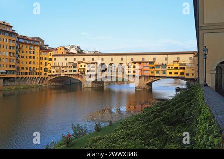 FLORENCE, ITALY - SEPTEMBER 18, 2018: This is an embankments of the Arno River and the medieval Vecchio Bridge. Stock Photo