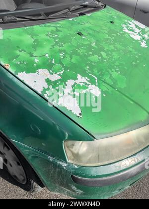 Cracked and peeling paint on an old car for background. Stock Photo