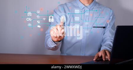 Computer security concept and protection of confidential data. man with laptop at office desk. Stock Photo