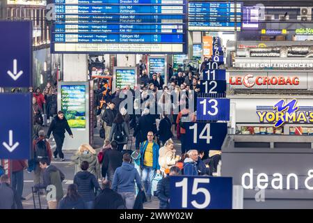 Central station, travellers in the platform hall. Extensive construction work on the railway network is communicated on the display board, Stuttgart Stock Photo