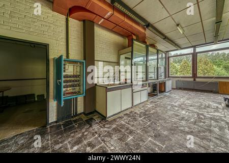 An abandoned laboratory with old equipment and white tiles under daylight, Institute of Molecular Biology, Lost Place, Sint-Genesius-Rode, Province Stock Photo