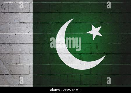 Flag of Pakistan painted on a cinder block wall. Stock Photo