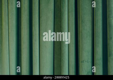 Folded Green velvet curtain texture, background Stock Photo