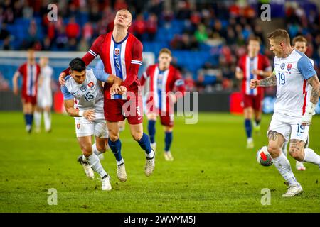 Oslo, Norway, 26th March 2024. Norway's Erling Braut Haaland is stopped by Slovakia's Vernon in the friendly match between Norway and Slovakia at Ullevål Stadium in Oslo  Credit: Frode Arnesen/Alamy Live News Stock Photo